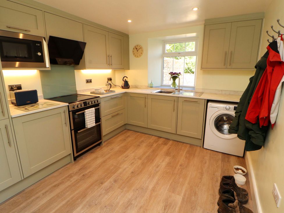 A kitchen with appliances and cabinets at East View in Kirkby Stephen