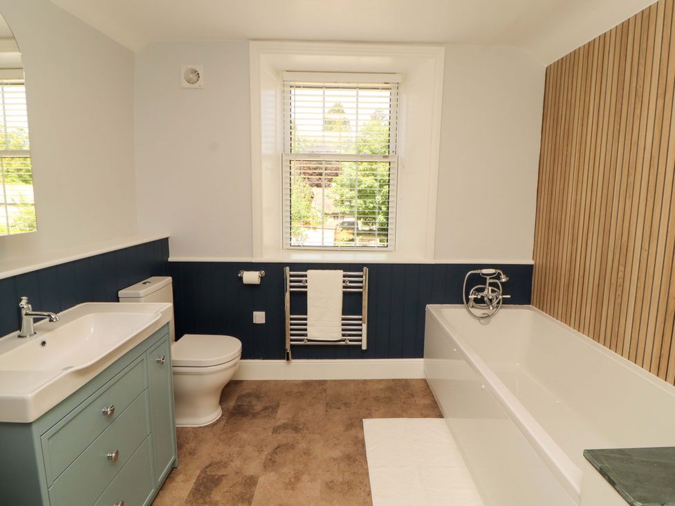 A bathroom with a bathtub and sink at East View in Kirkby Stephen