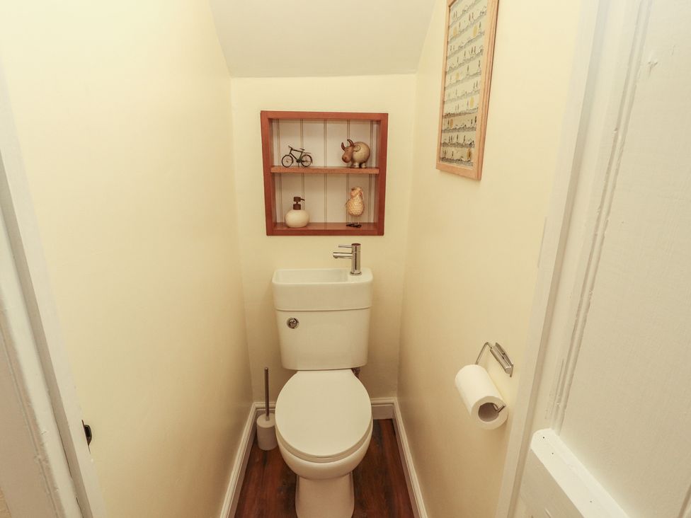 A bathroom with a toilet and sink at East View in Ravenstonedale near Kirkby Stephen