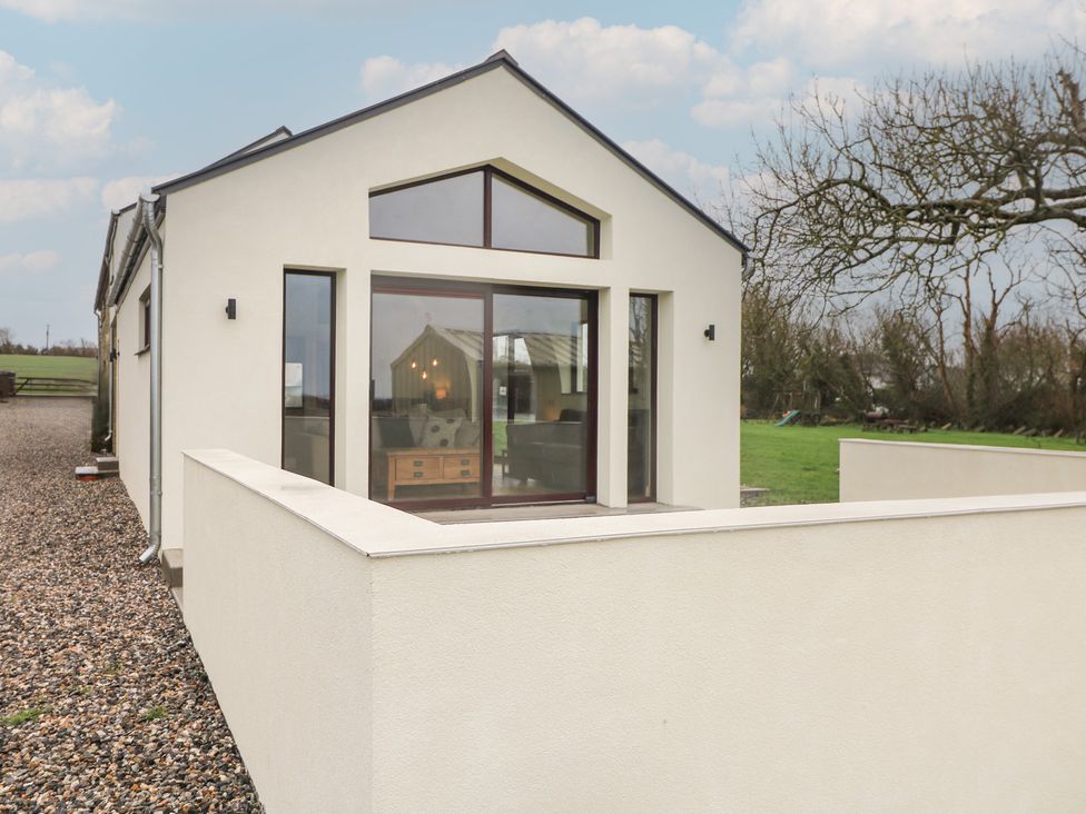 An exterior view of a house with windows at The Rookery in Rosslare Harbour, County Wexford