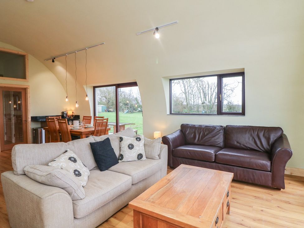 A living room with a sofa and coffee table at The Rookery Rosslare Harbour County Wexford