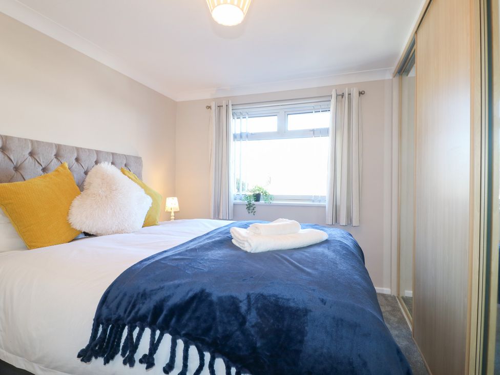 A bedroom with a bed and a window at The Cuckoo's Rest in Melton Mowbray