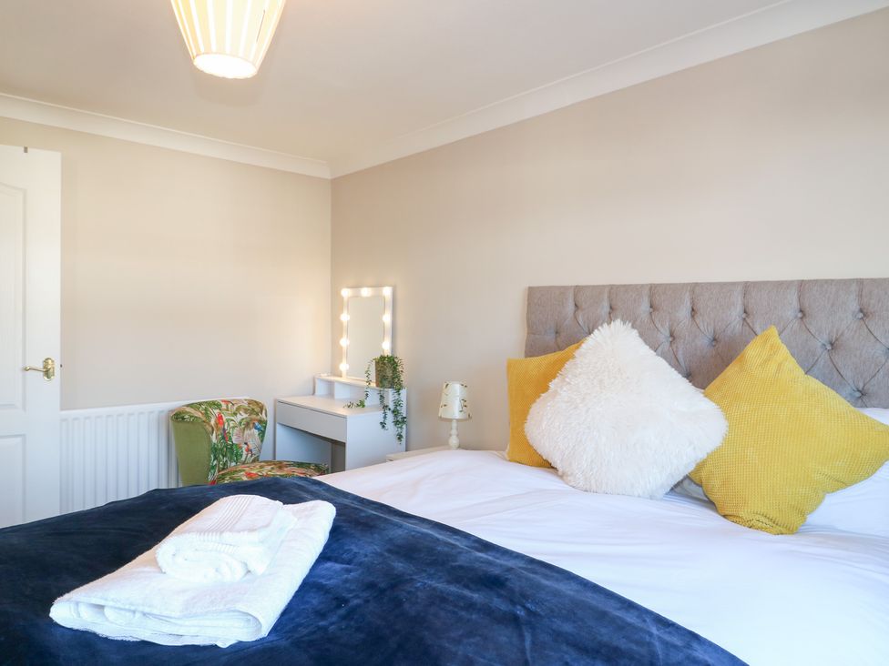 A bedroom with a bed and desk at The Cuckoo's Rest in Melton Mowbray