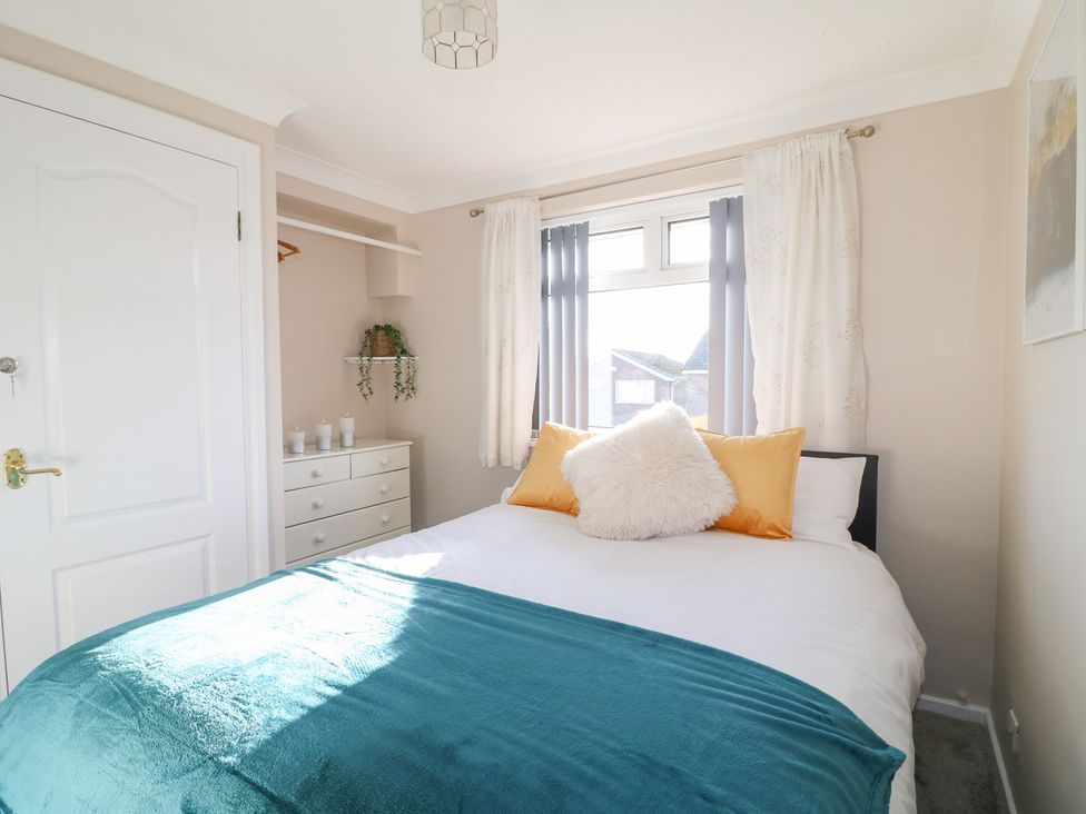 A bedroom with a bed and dresser at The Cuckoo's Rest in Melton Mowbray