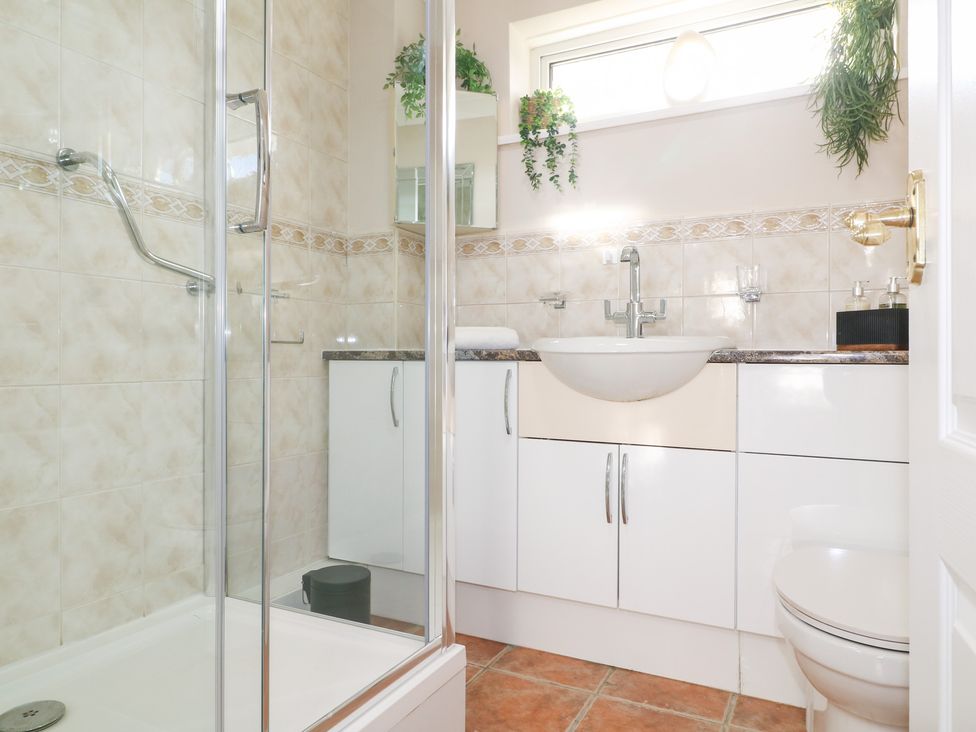 A bathroom with a shower and sink at The Cuckoo's Rest in Melton Mowbray