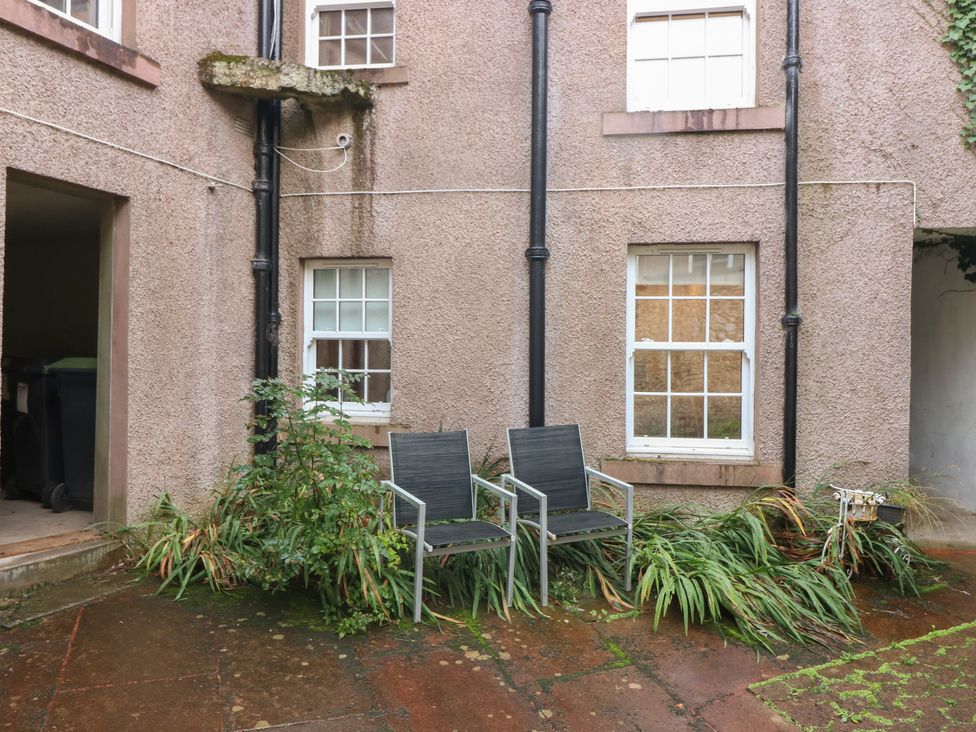 An outdoor area with chairs and plants at 2 East Port Melrose