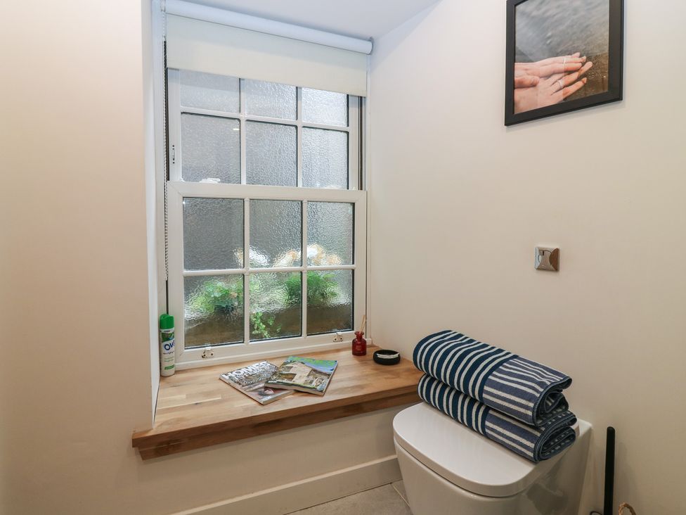 A bathroom with a window and a toilet at 2 East Port Melrose