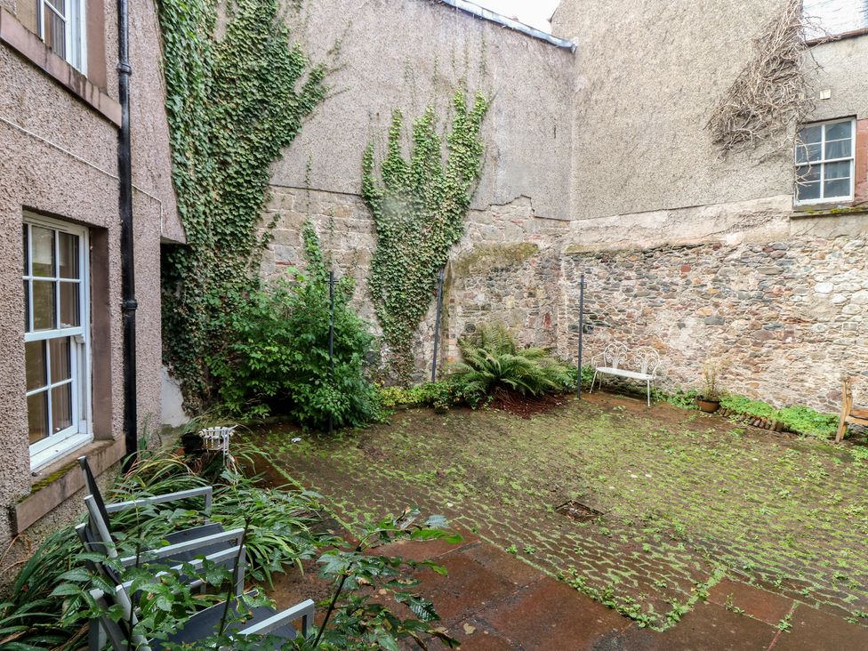 A garden with ivy and stone walls at 2 East Port in Melrose
