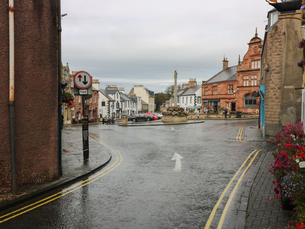 A street view with buildings and traffic signs in Melrose