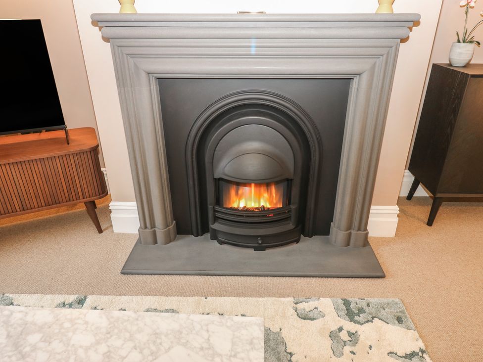 A fireplace in a living room at Fairfield House Almondbury