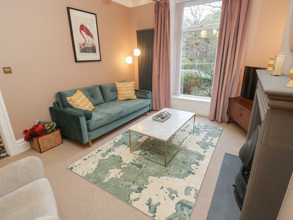 A living room with a sofa and coffee table at Fairfield House Almondbury