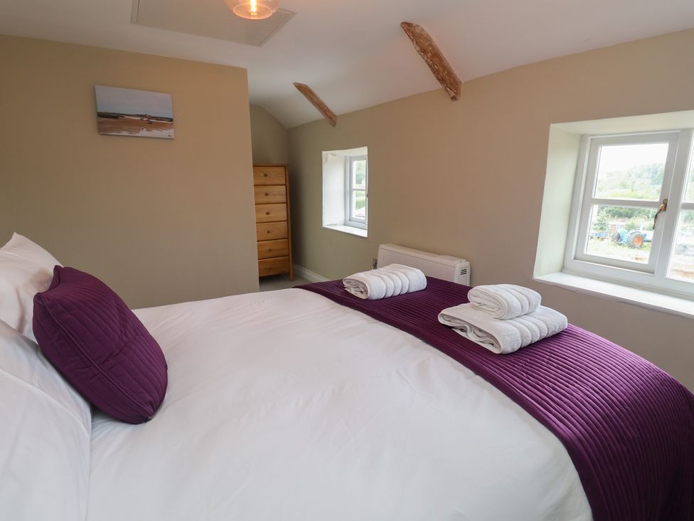 A bedroom with a bed and dresser at 6 Gravel Hill in King's Lynn