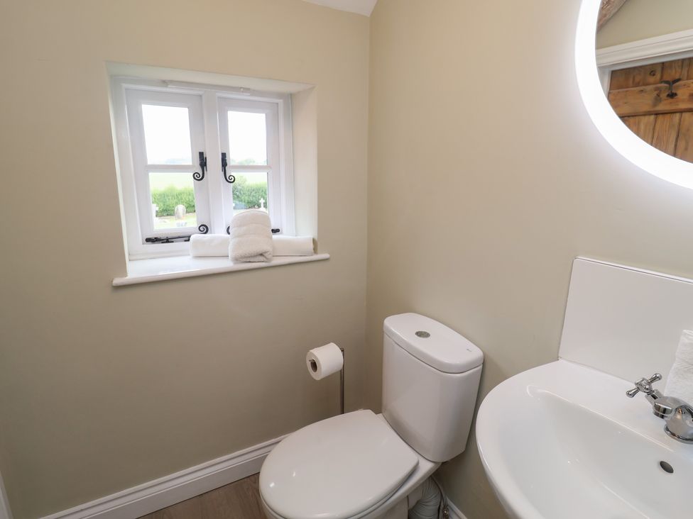 A bathroom with a sink and toilet at 6 Gravel Hill in King's Lynn