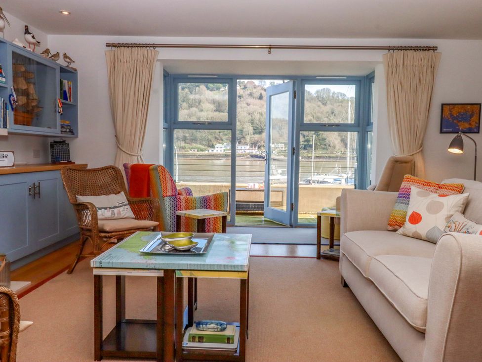 A living room with a sofa and coffee table at 26 Dart Marina