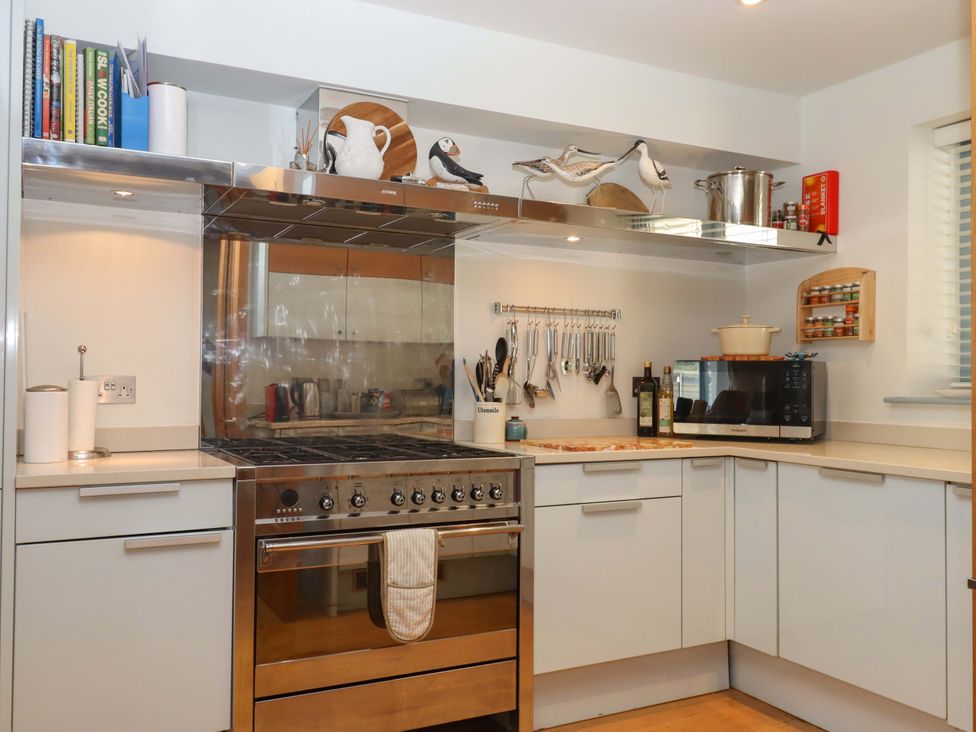A kitchen with stove and microwave at 26 Dart Marina