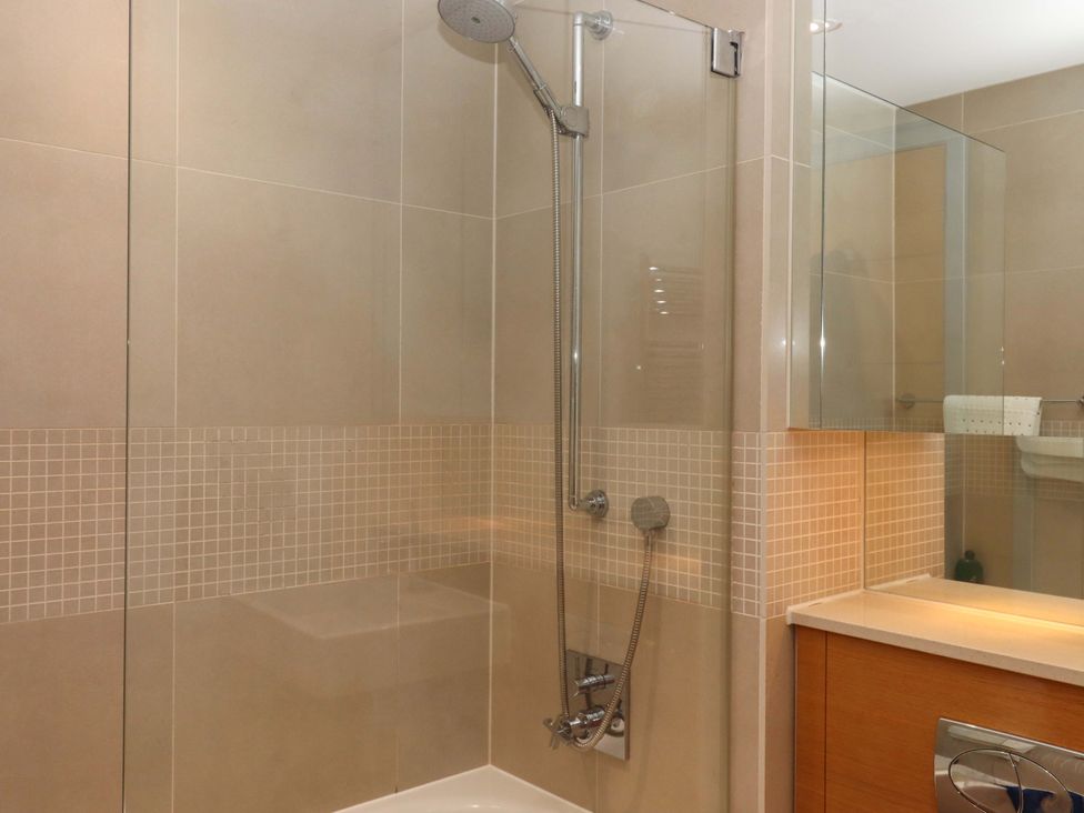 A bathroom with a shower and sink at 26 Dart Marina 