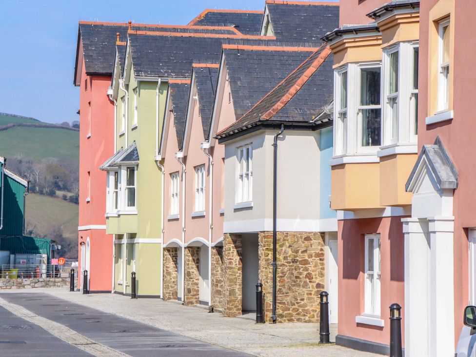 A row of houses with varying colors in a residential area at 26 Dart Marina