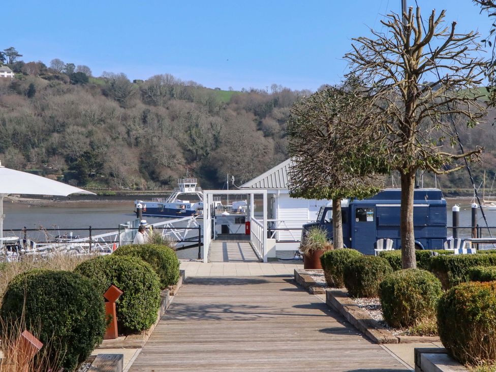 A pathway leading to a dock with boats at 26 Dart Marina