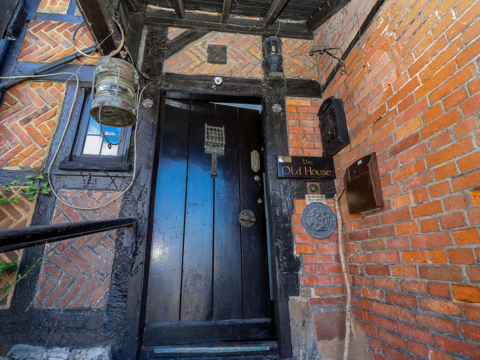 An entrance door with a sign and mailbox at The Old House in Hamble