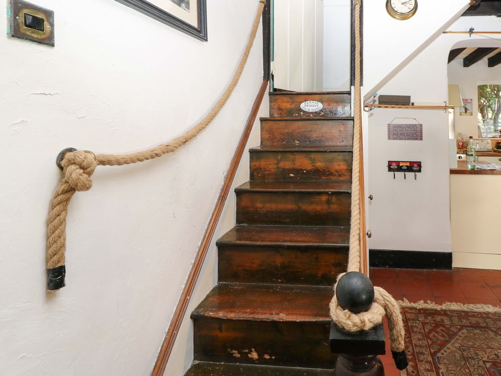 A staircase with rope railing at The Old House in Hamble