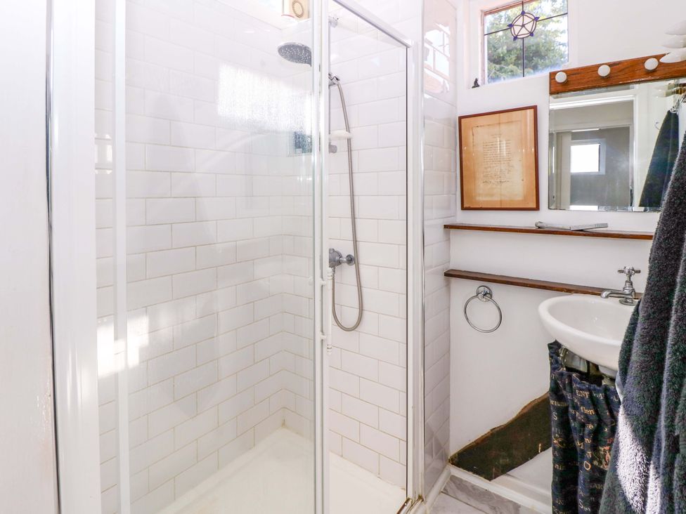 A bathroom with a shower and sink at The Old House in Hamble