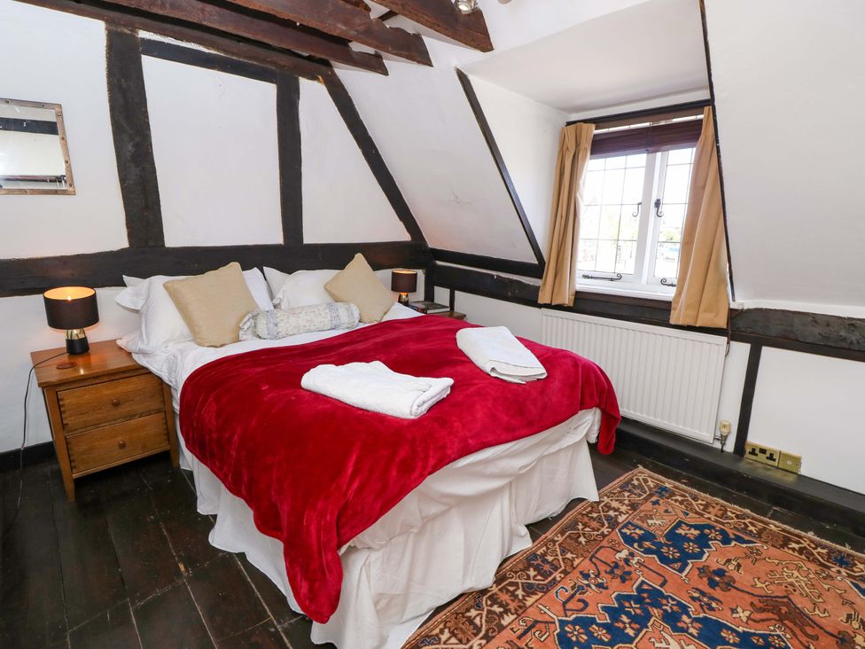 A bedroom with a bed and a window at The Old House in Hamble