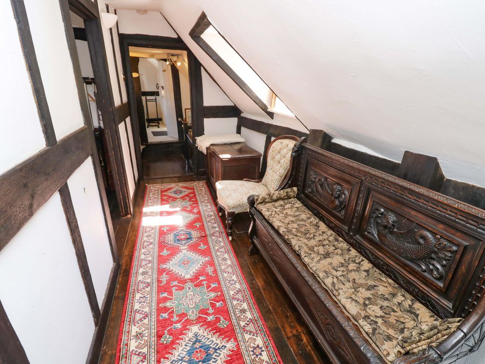 A hallway with a sofa and a chair at The Old House in Hamble