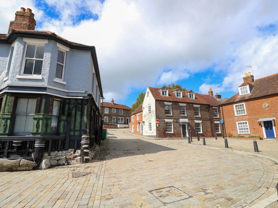 A street scene with buildings and cobblestone pavement at The Old House in Hamble