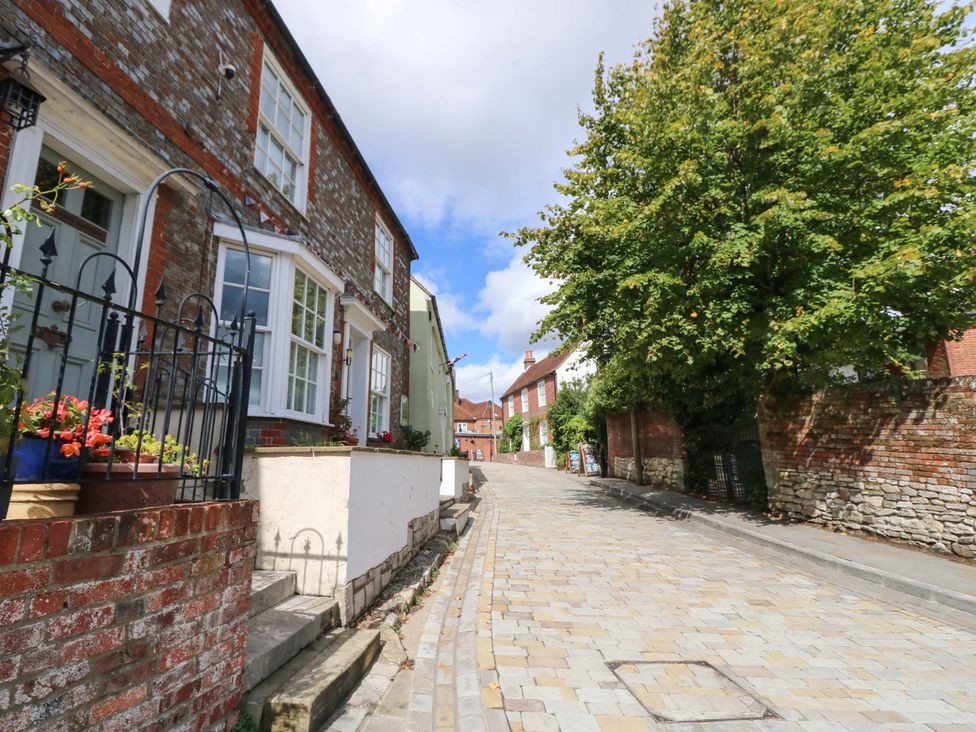 A street with brick buildings and a tree at The Old House in Hamble