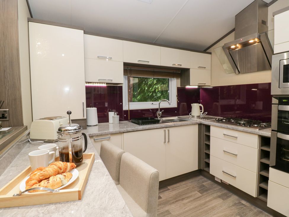 A kitchen with sink and countertop at Feather Hill Lodge Windermere
