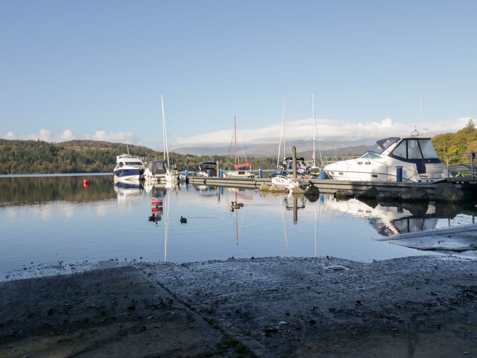 A marina with boats on the water at Feather Hill Lodge near White Cross Bay near Troutbeck Bridge