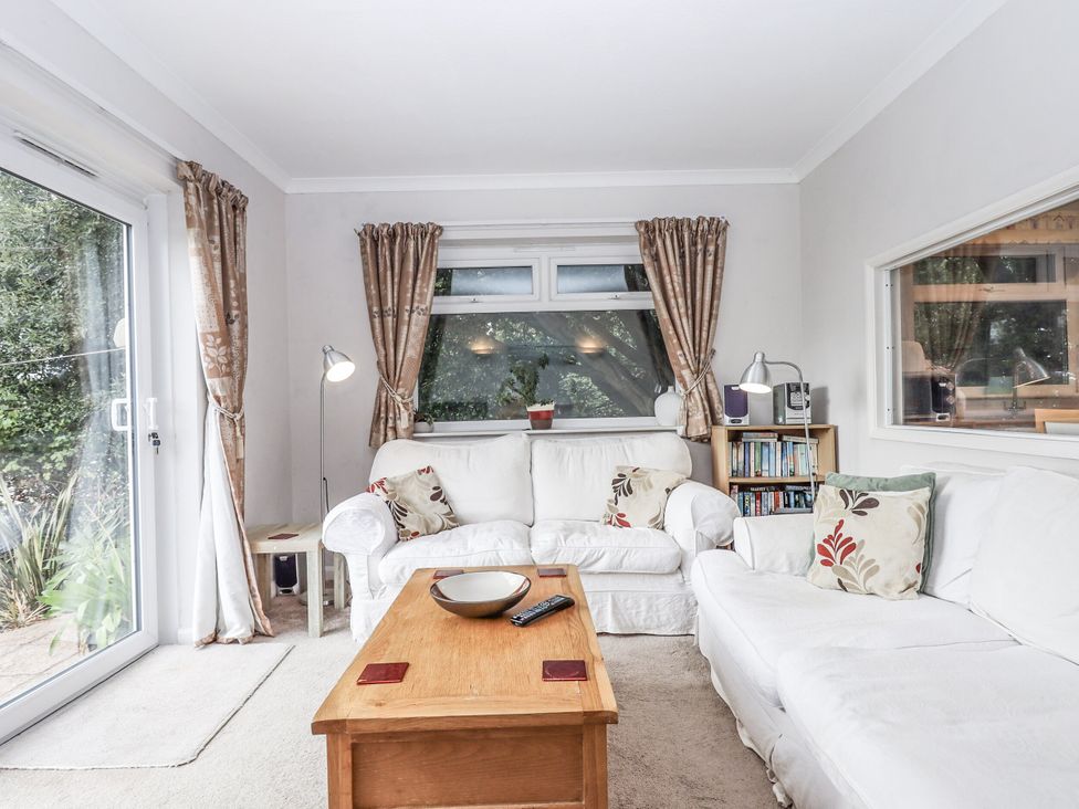 A living room with a sofa and coffee table at Mayflower View Dawlish