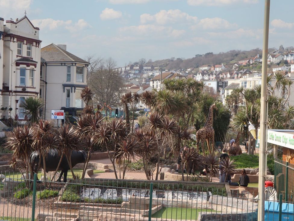 A view of a park with animal statues and landscaping at Mayflower View, Dawlish