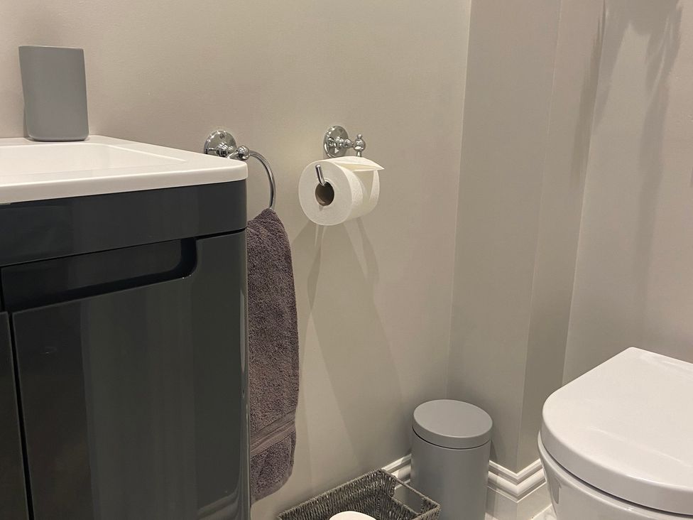 A bathroom with a sink and toilet at The Cart Shed in Bedford
