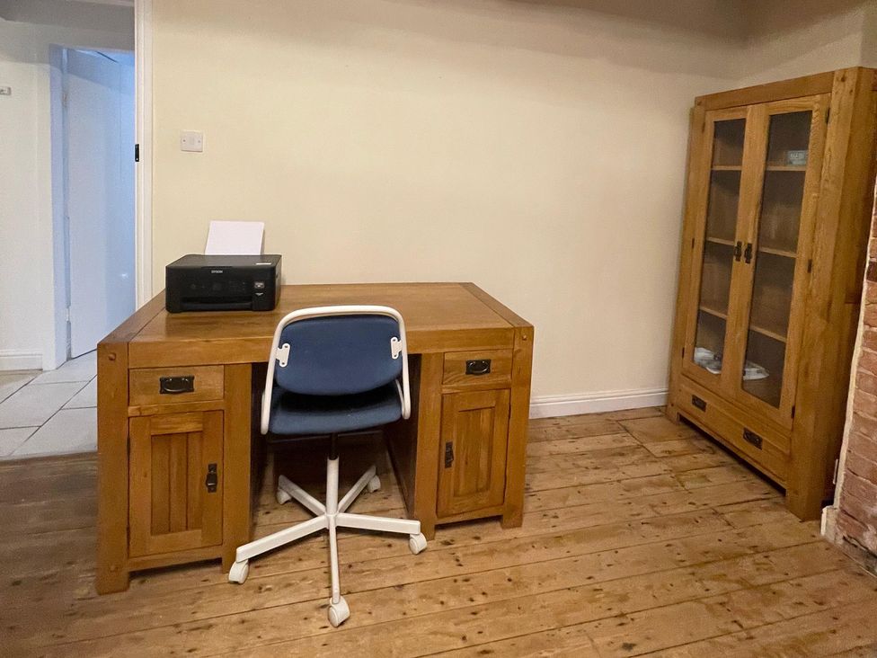 An office with a desk, chair, printer, and cabinet at 15A Currier Lane, Ashton-under-Lyne