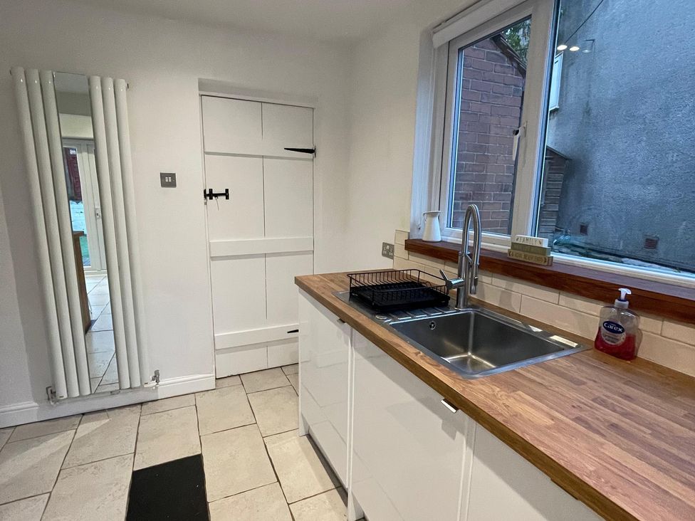 A kitchen with a sink and cabinets at 15A Currier Lane Ashton-under-Lyne