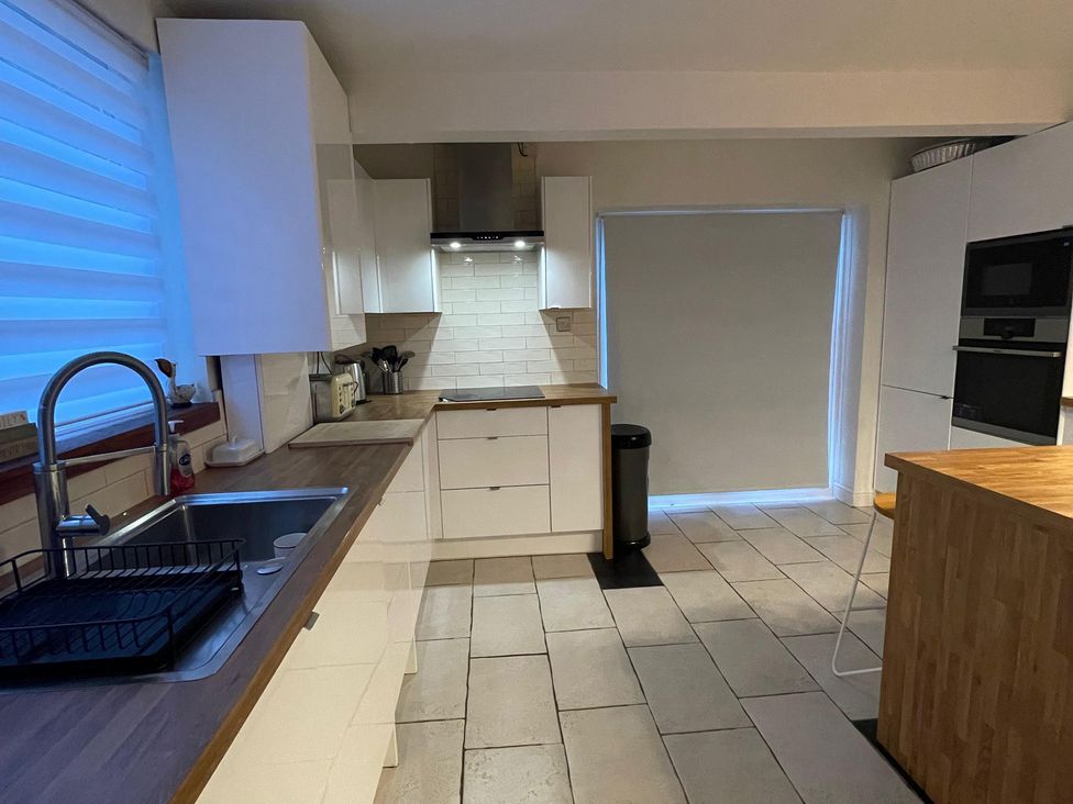 A kitchen with a sink and countertop at 15A Currier Lane Ashton-under-Lyne