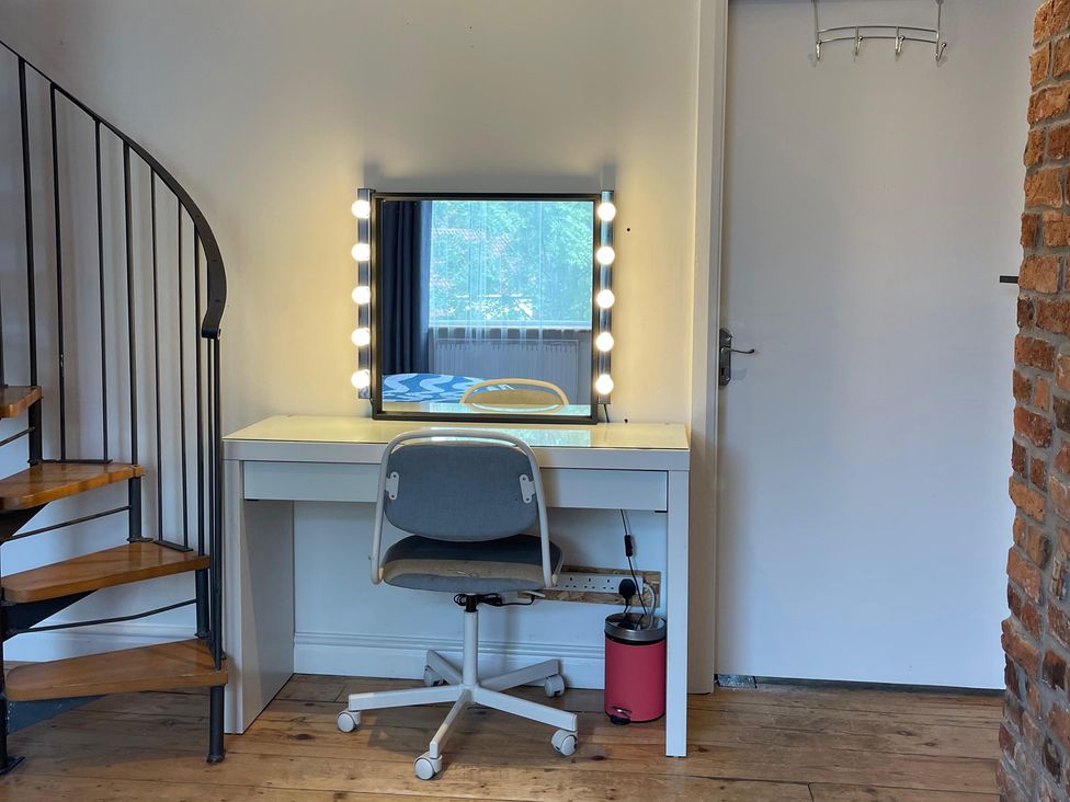 A bedroom with a vanity desk and mirror at 15A Currier Lane Ashton-under-Lyne
