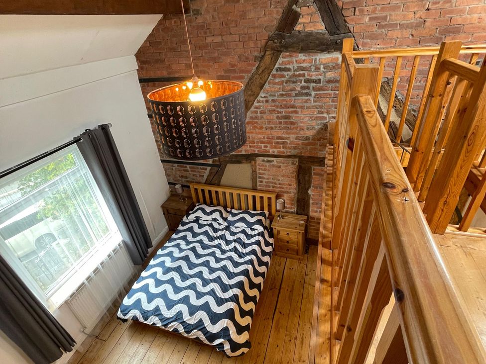 A bedroom with a bed and window at 15A Currier Lane Ashton-under-Lyne