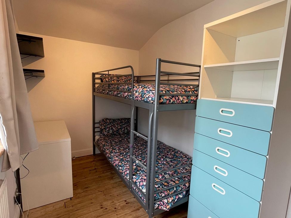 A bedroom with a bunk bed and drawer unit at 15A Currier Lane Ashton-under-Lyne