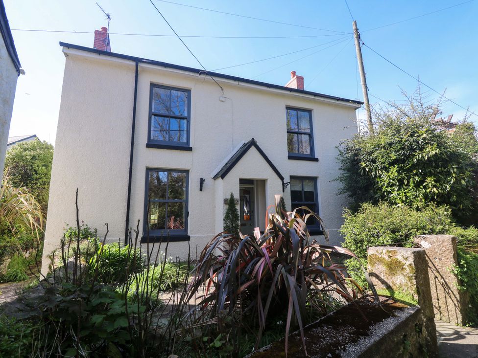 A house with plants and windows at Pedn Brose near Mousehole