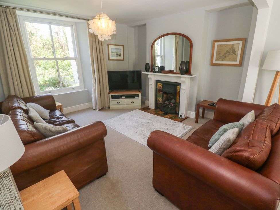 A living room with sofas and a television at Pedn Brose Near Mousehole