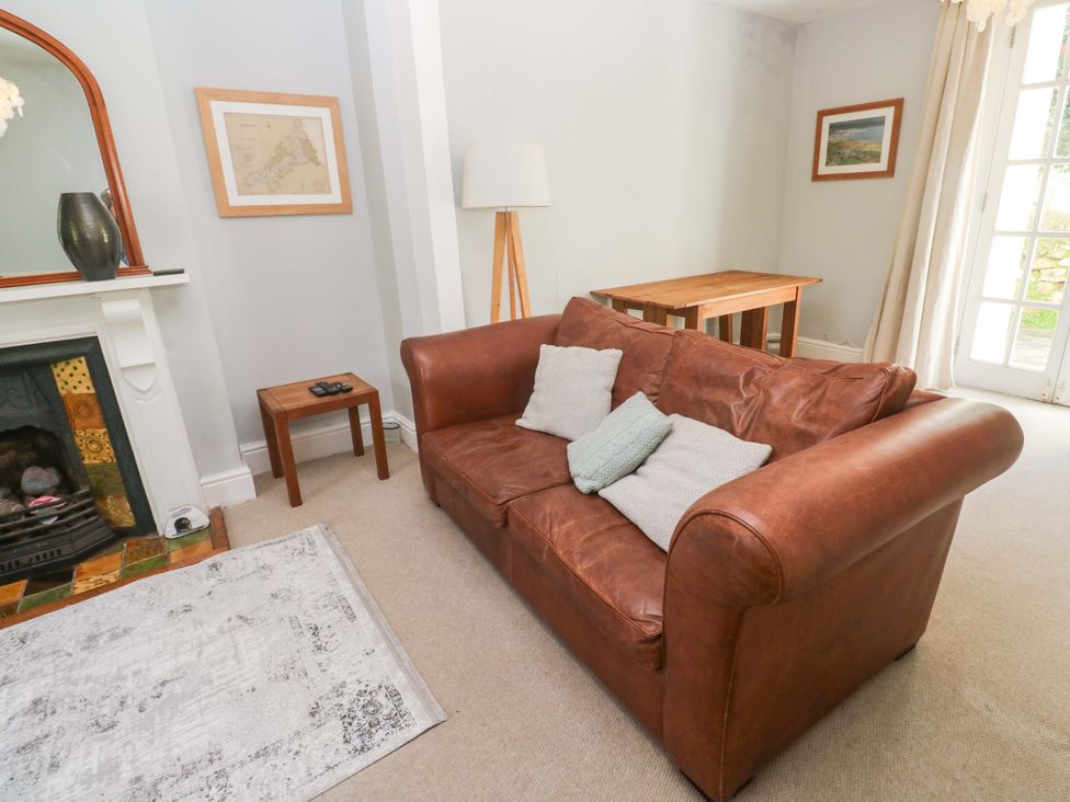 A living room with a sofa and a coffee table at Pedn Brose near Mousehole