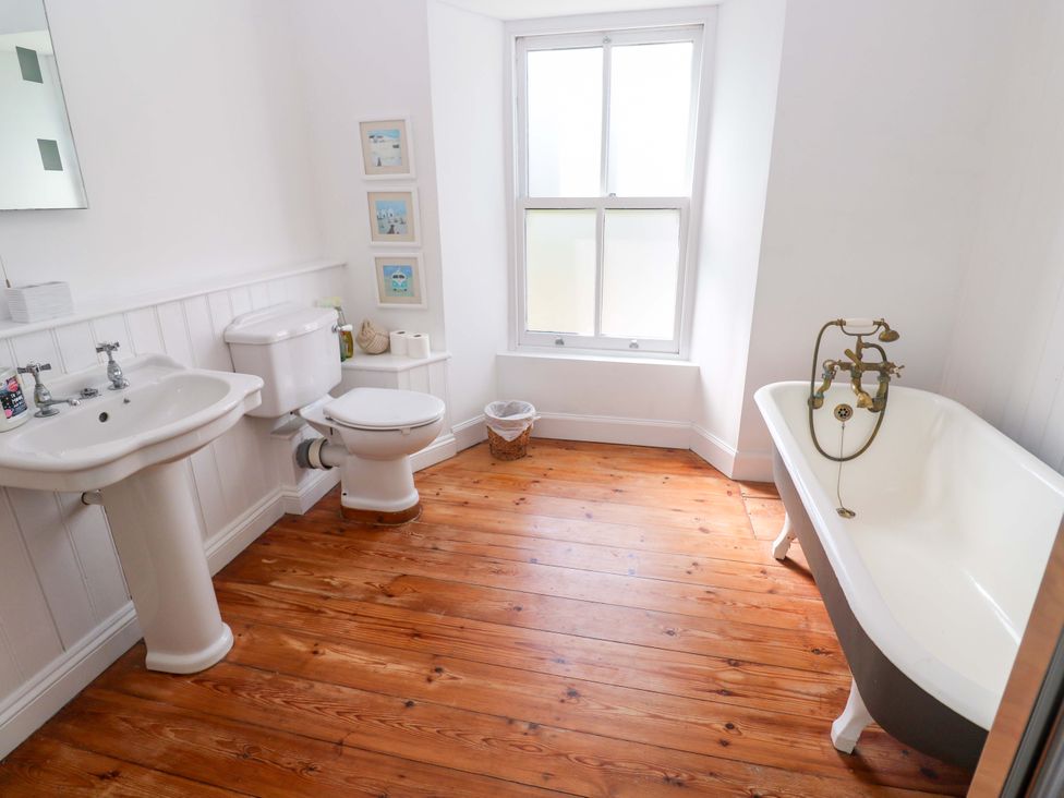A bathroom with a bathtub and sink at Pedn Brose Near Mousehole