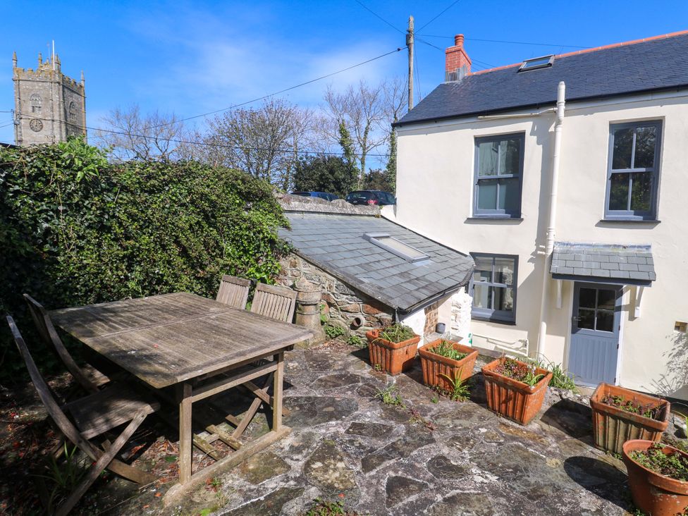 A garden with a table and chairs at Pedn Brose Near Mousehole