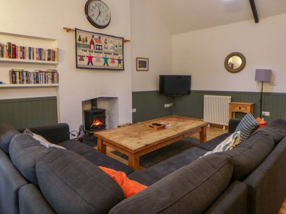 A living room with a sofa and a coffee table at The Old Sunday School in Cwmwysg near Sennybridge