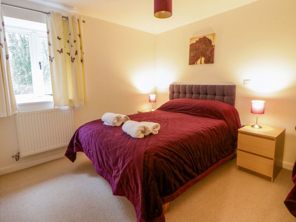 A bedroom with a bed and a window at The Old Sunday School Cwmwysg near Sennybridge