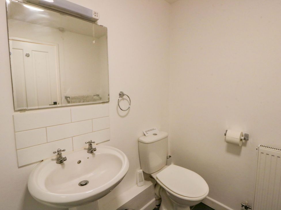 A bathroom with a wash basin and toilet at The Old Sunday School in Cwmwysg near Sennybridge