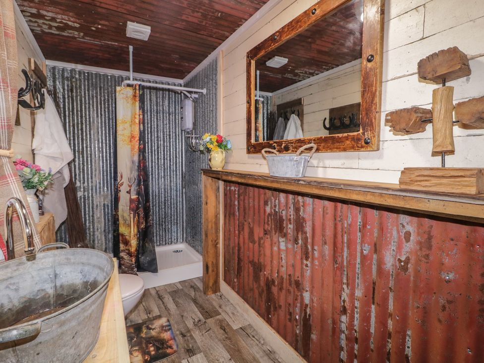 A bathroom with a shower and sink at Rusty Barn in Limavady