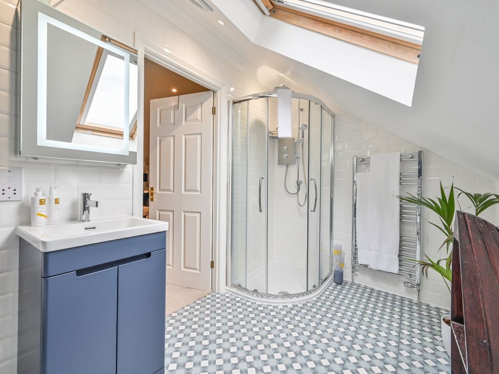 A bathroom with a shower and sink at Lisburne Place Torquay